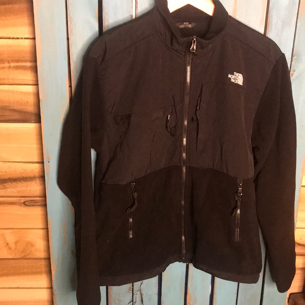 The North Face black and white full zip water resistant at the top Small